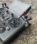 Tandem X20 Pro AW Radio Transmitter Battleship Grey Ultimate Combo with TD SR18 Receiver on rocky surface, front view