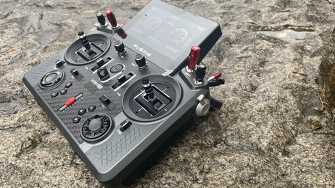 Tandem X20 Pro AW Radio Transmitter Battleship Grey Ultimate Combo with TD SR18 Receiver on rocky surface, front view
