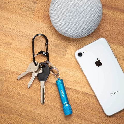 G-Series Dual Chamber Carabiner Size 3 One Pack Black Grab-And-Go Key Clip With Dual Gates next to smartphone and keys on table