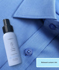 3-In-1 No Iron Wrinkle Release, Static Cling Remover, Odor Eliminator And Fabric Refresher Spray bottle on blue shirt