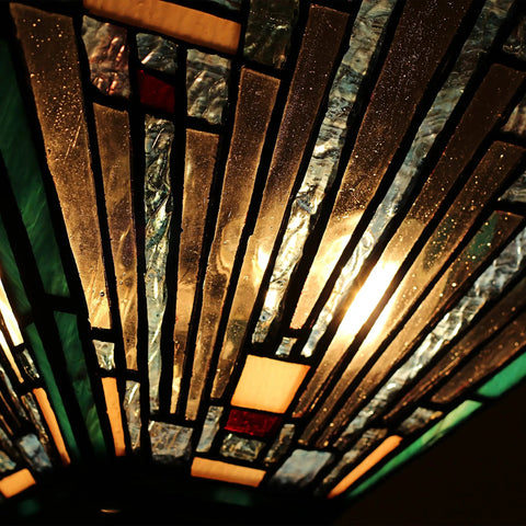 Close-up view of Two Light Tiffany Style Mission Ceiling Fixture In Blackish Bronze Finish, Innes Inspired Design with glass pieces.