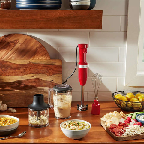Heavy Duty Corded Hand Blender Kitchen Workhorse With Variable Speed Dial And Stainless Steel Blades on kitchen counter with bowls and ingredients.