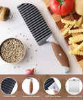 Top view of a crinkle cutter knife with brown ergonomic rubber handle and stainless steel wave blade for vegetables
