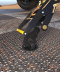 Close-up of Beefy Rugged Car Tie Down Straps For Trailers 2 Inch Wide By 10 Foot Long With 10000 Pound Break Strength securing a trailer.