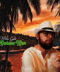 Man in white hat and shirt holding a pen against tropical sunset background with palm trees and orange sky.