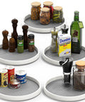 12 Inch Lazy Susan Spice Organizer Rotating Tray Set 5 Pack Non Slip Rimmed Edge with jars and condiments displayed