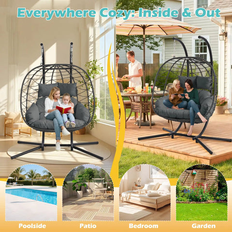 Double Outdoor Hanging Egg Chair With Stand And Oversized Cushion in gray on patio, seating two people, garden background.