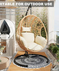 Oversized Hanging Egg Chair With Stand For Indoor And Outdoor Use Wicker Swing Chair With 400Lb Capacity Perfect For Bedroom Patio Garden Or Balcony Beige Nest Extra Wide Comfort For One Person on a balcony with a cover