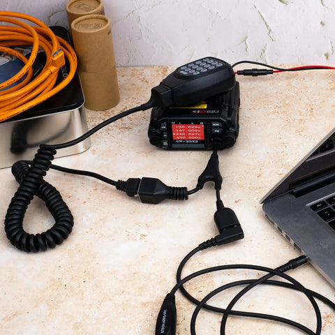 UV-25X2 Second Gen Mini 25 Watt Dual Band Base Station Radio with RJ45 microphone on desk, ideal for home use.