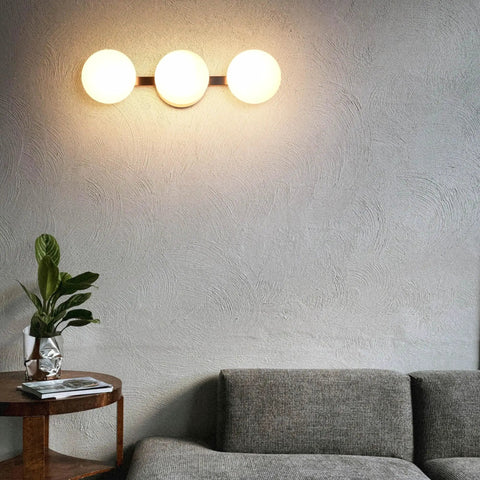 Modern 3 Light Globe Vanity Light Fixture Brushed Nickel Wall Mount Sconce with Opal Glass in living room setting