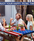 Flag Themed Picnic Table Cover With Bench Covers Set Wood Grain Look Waterproof Windproof No Hassle Outdoor Tablecloth Fitted For 72 Inch Tables And 12 Inch Benches Three Piece Kit Red with friends enjoying a meal outdoors.