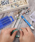 Hands using 21 Piece Metric Mini Drill Bit Set With Pin Vise For Ultra Fine Wood And Jewelry DIY HSS Twist Drills on a bead project.