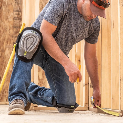 Man wearing Gel Stabilizer Knee Pads with Dual Layer Padding and Non Skid Grip working on construction site floor