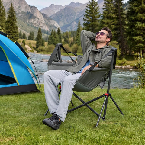 Man relaxing in Oversized Hammock Camping Chair With Adjustable Backrest For Next Level Comfort And Support 350LBS Heavy Duty Portable Folding Rocking Chair