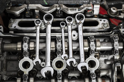 Beefy Thirteen Piece SAE Reversible Ratcheting Wrench Set With 12 Point Box Ends used on engine, showcasing durability and function.