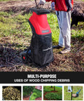Person using Electric Wood Chipper Shredder For Home Yard Cleanup With A 15 Amp Motor Shreds Branches Up To 1.77 Inch