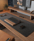 Durable Felt Desk Pad For An Ultra Smooth Workstation Mouse Pad And Keyboard Mat Large 36 By 12 Inches Desk Protector In Dark Gray For Home Office And Gaming Setups on a wooden desk