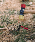 Hammer fitting a Beefy 16 Pack 7075 Aluminum Tent Stake 7.25 Inch Long Heavy Duty Ground Pegs Rust Resistant For Camping Canopy And Tarp Keeps Tents Secure In High Wind into the ground