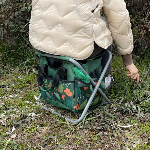 Person using Foldable Gardening Stool With Detachable Storage Tote For Gardening Camping And Fishing Tools Organizer.
