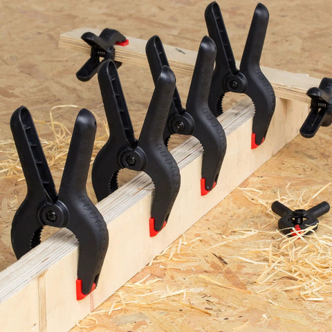 20-Pack Nylon Plastic Spring Clamps Four Sizes With String Bag Organizer For DIY Projects Photography Gluing Gripping And More Includes 6-1/2in 4-1/2in 3-1/2in And 2-1/2in displayed clamping wood