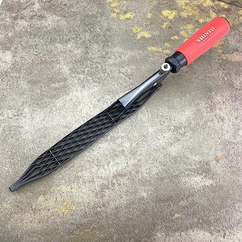 Japanese Rasp And Sanding Block Quick Swap Blades Non Clogging Teeth Fast Stock Removal Dead Simple One Handed Operation Heavy Duty Rubber Grip Built Damn Tough For Woodshop Pros on grey surface.