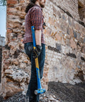 Worker holding 6 Pound Heavy Duty Hard Face Sledge Hammer Beast For Demolition And Stake Driving With 36 Inch Fiberglass Handle