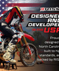 Motorcyclist on dirt bike using adjustable top magnetic motocross and dirt bike stand with universal fit, USA flag background.