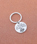 Trust Me I Am An Engineer Keychain With Gear Design on brown background, featuring stainless steel charm and humorous engraving.
