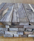 Scrap Walnut Box Of 3/4 Inch Thick Boards In A 17 By 14 By 5 Inch Crate, Leftover Walnut With Rough Edges And Knots stacked