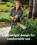 Person trimming hedges with 22 Inch Cordless Hedge Trimmer With Dual Action Blades, Lightweight 5.5 Lbs Yard Tool