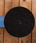 Top view of 6 Inch Replacement Sanding Pad For Dual-Mode Random Orbit Sander GET75-6N on wooden surface