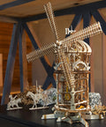 Tower Windmill 3D Puzzle Kit For Adults With Moving Parts Wooden Mechanical Model Building Kit DIY Craft Project For Fathers Day Mind Blown Wood Puzzle 585 Pieces assembled and displayed on a table.