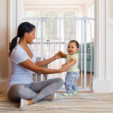 Multi-Use Extra Tall Walk Through Baby Gate In Metal White Finish, 36 Inch Tall, in a doorway with a woman and baby playing