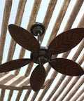 Bronze outdoor ceiling fan installed under a pergola, featuring leaf-shaped blades for decorative outdoor settings.