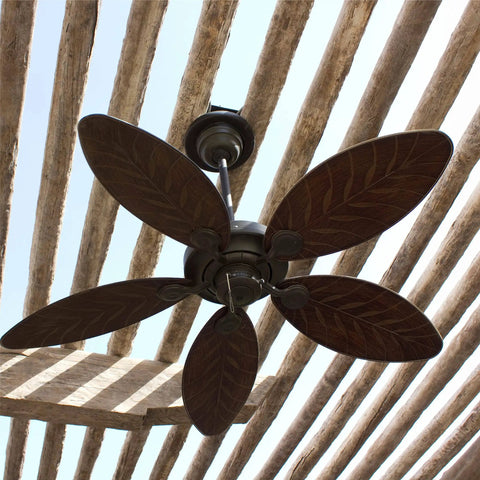 Bronze outdoor ceiling fan installed under a pergola, featuring leaf-shaped blades for decorative outdoor settings.
