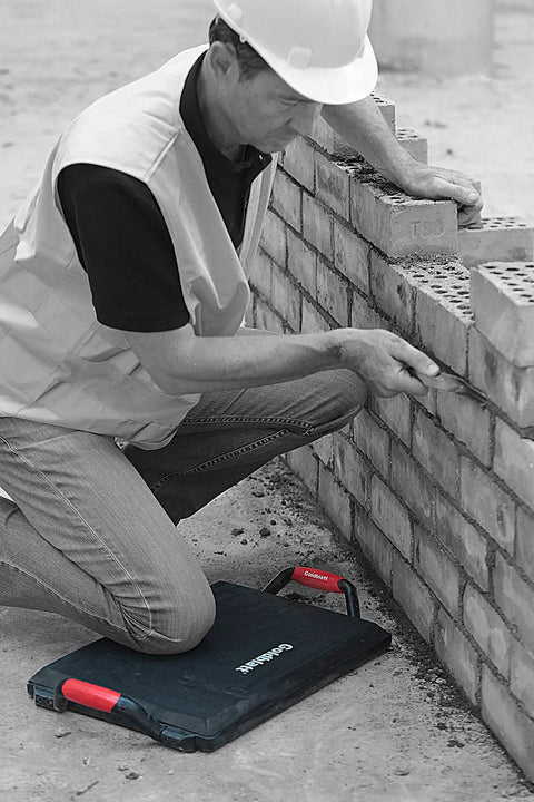 Worker using heavy duty kneeler board for pros and weekend warriors 18 inch durable polypropylene knee pad on concrete job