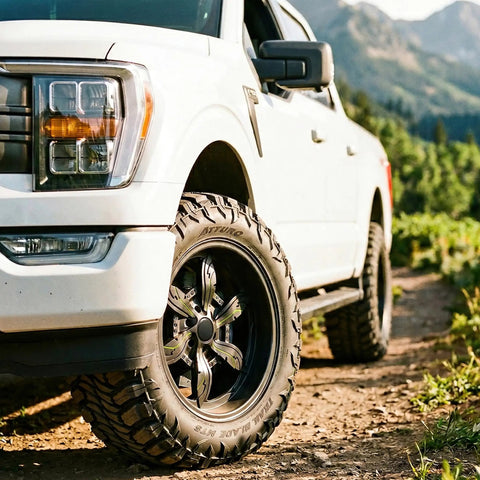 Trail Blade MTS Mud Terrain Radial Tire For Light Trucks And Jeeps, 35X13.50R24LT displayed on a white truck off-road