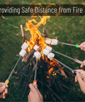Telescoping Stainless Steel Roasting Sticks 32 Inch 5 Pack Marshmallow Skewers with wood handles near campfire