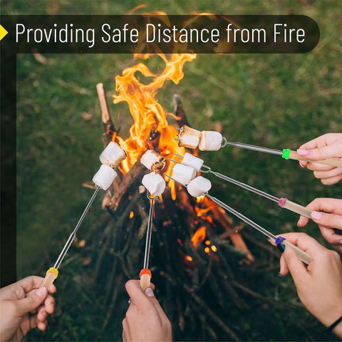 Telescoping Stainless Steel Roasting Sticks 32 Inch 5 Pack Marshmallow Skewers with wood handles near campfire