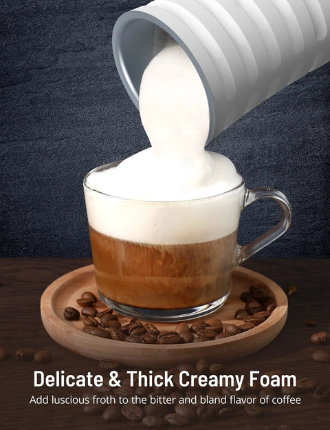 Pouring creamy foam from 4 In 1 Milk Frother With Temperature Control For Hot Or Cold Foam Barista Grade Foam into coffee cup