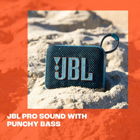 Go 4 Ultra Portable Bluetooth Speaker That Goes Anywhere With Waterproof And Dustproof Build, Pro Sound And Punchy Bass, 7 Hour Battery, Made With Recycled Materials, Compact Blue resting on sand with handle.