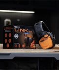 Bluetooth Hearing Protection Earmuffs For Worksite Use With Noise Reduction And All Day Comfort next to product box.