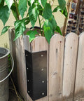 Heavy Duty L Brackets For Raised Garden Beds 4 Pack 9 By 3 Inch Black Steel Corner Braces attached to wooden planter box.