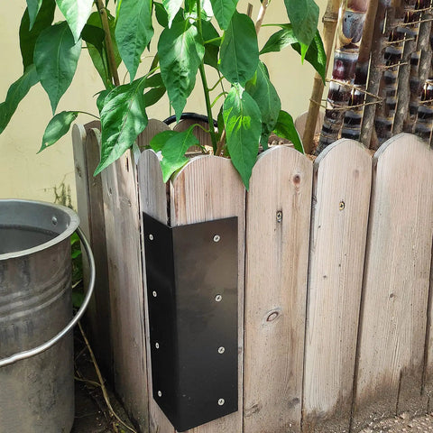 Heavy Duty L Brackets For Raised Garden Beds 4 Pack 9 By 3 Inch Black Steel Corner Braces attached to wooden planter box.