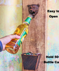 Heavy Duty Cast Iron Bear Head Wall Mounted Bottle Opener With Nifty Little Cap Catcher Antique Copper Finish in use with bottle.