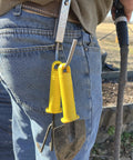 Person using Universal Tool Holder Belt Hook For Cordless Drills Saws And More Left Or Right Hand Use Durable Tool Holster Made In The USA