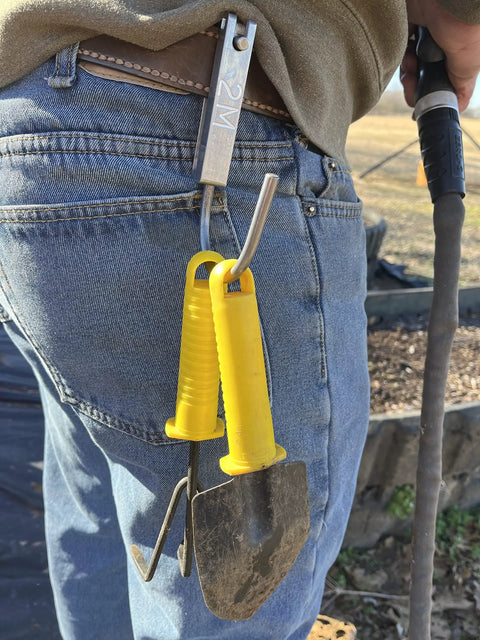 Person using Universal Tool Holder Belt Hook For Cordless Drills Saws And More Left Or Right Hand Use Durable Tool Holster Made In The USA
