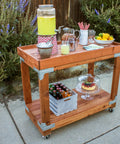 Outdoor wooden cart made with Beefed Up Heavy Duty Workbench And Shelving Hardware Kit Two Pack With RTC2Z Connectors, serving lemonade.