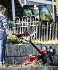 Woman using Pioneer Dual Direction Rear Tine Tiller with CRT and SRT tines, 99cc Viper engine, red and black finish