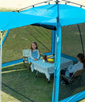 Instant Pop Up Screen House Gazebo 8.2 By 8.2 By 75 Inches Portable Canopy With Mosquito Netting and UPF Sun Protection in blue, set up in a garden.